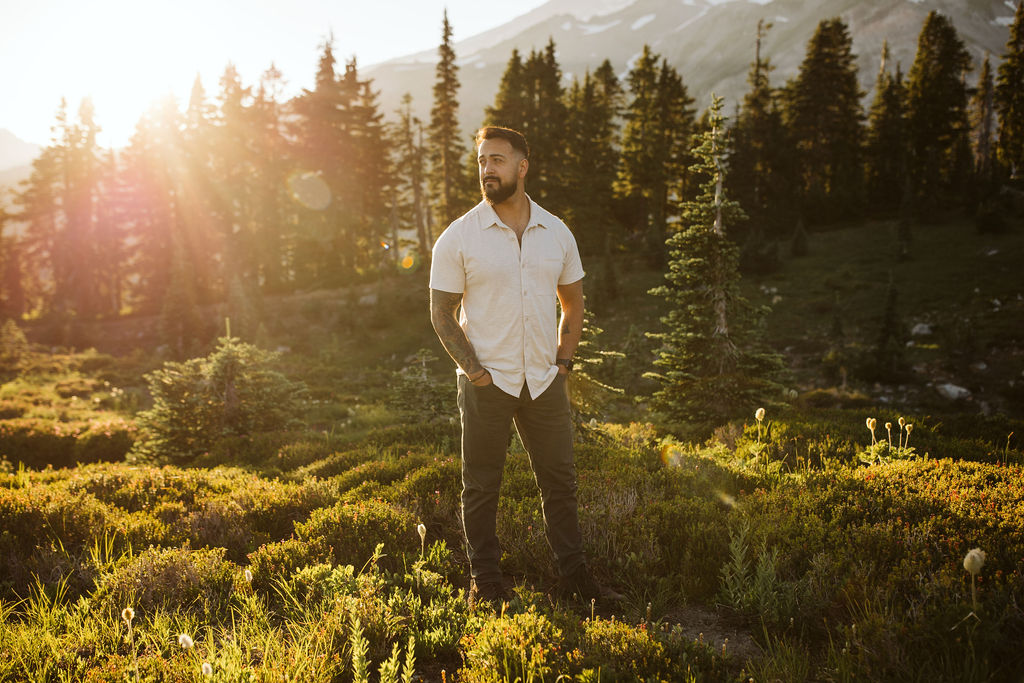 man stands in a meadow