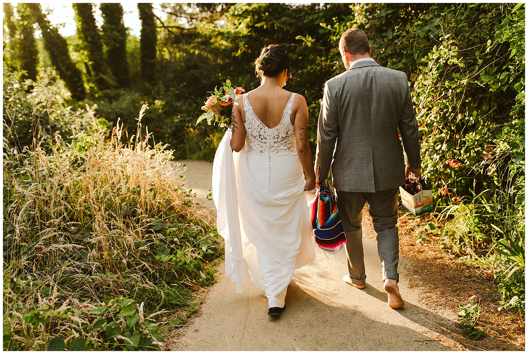 couple walks down the path on their sunny elopement day, a stress free experience that gave them a great reason to elope.