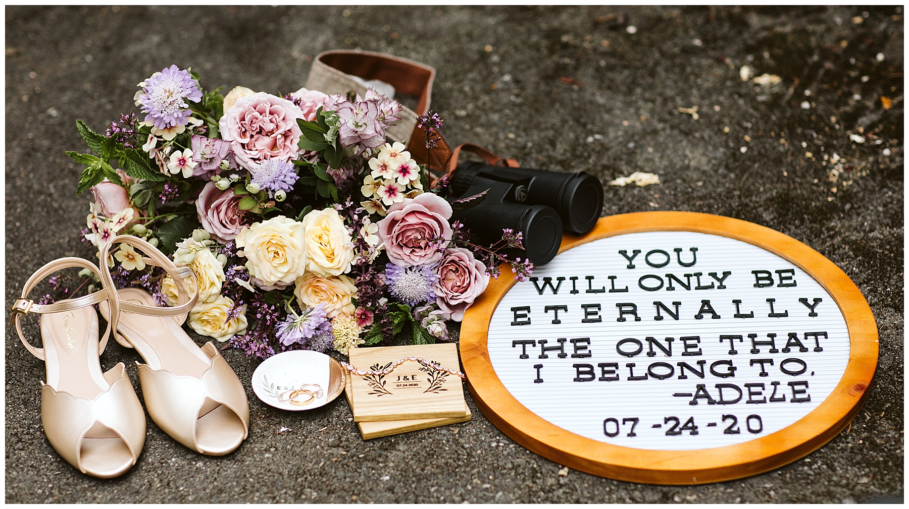 mount rainier elopement details, including bride's shoes, rings, letterboard sign, florals, and binoculars. 