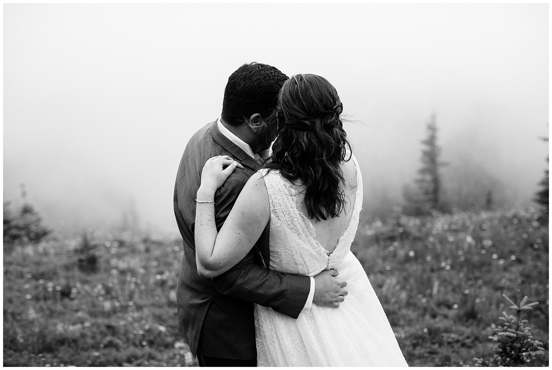 couple embraces at mount rainier for their elopement.