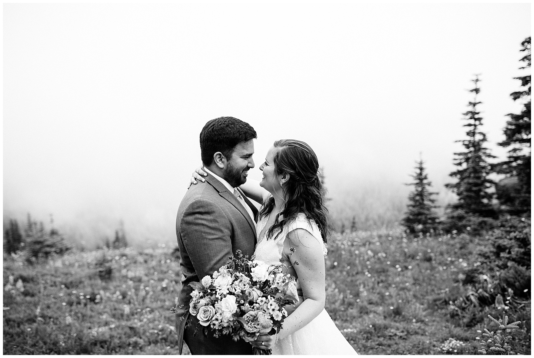 couple embraces at their elopement in mount rainier national park.