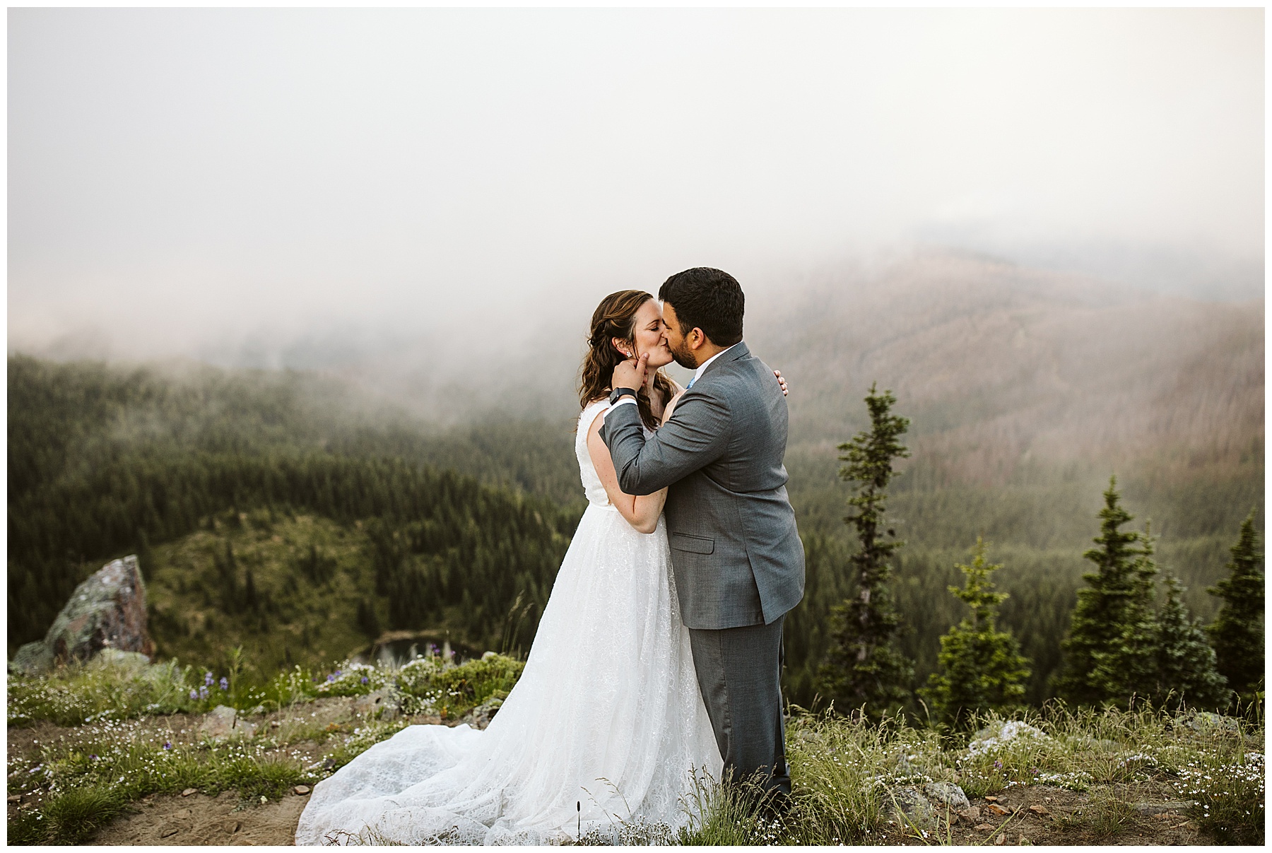 couple embraces at their elopement in mount rainier national park.