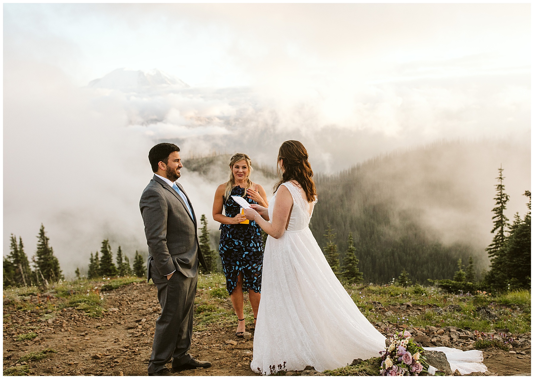 emily reads her vows to jay during their elopement ceremony in mount rainier.