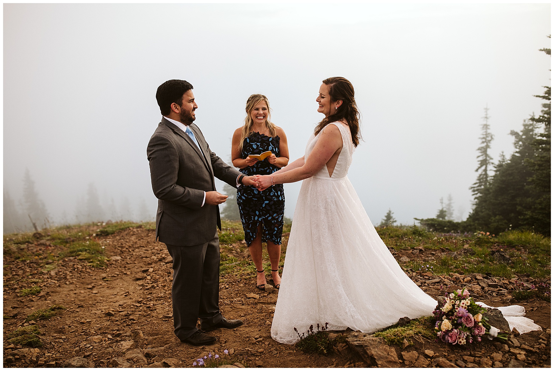 couple holds hands during their elopement ceremony in mount rainier national park.