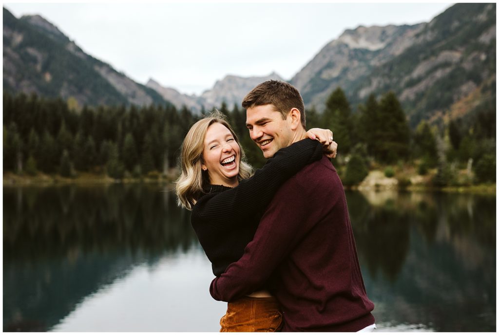 couple laughing maroon sweater fall background