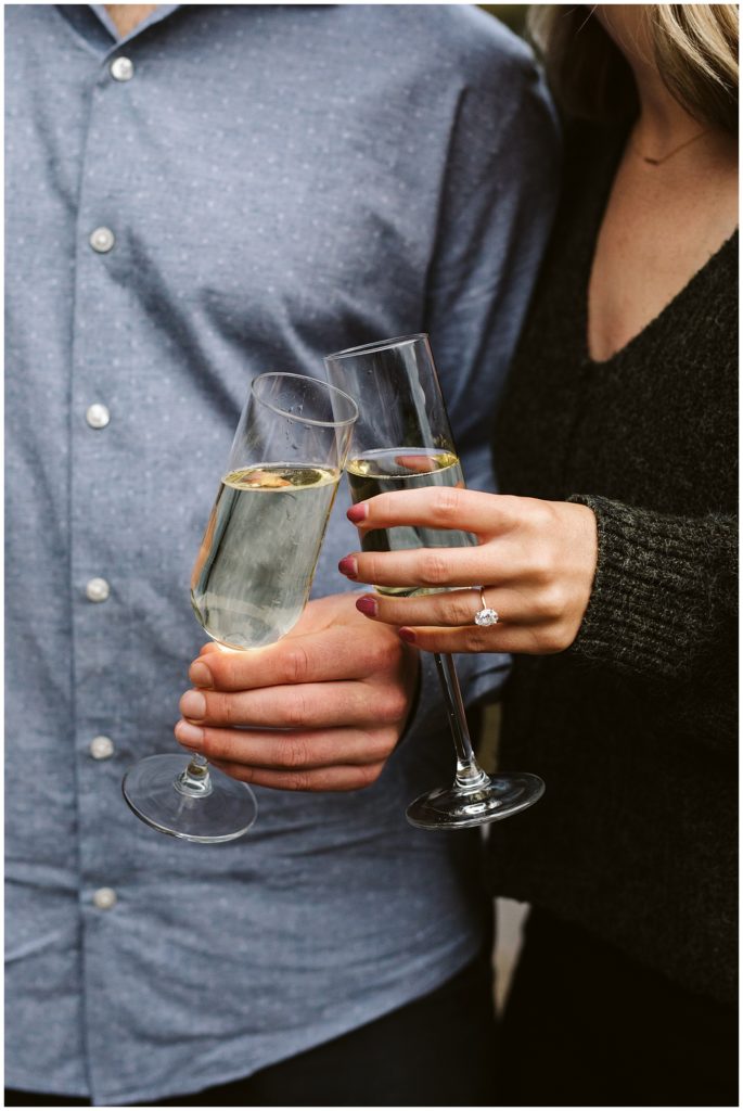 couple kissing toasting champagne glasses