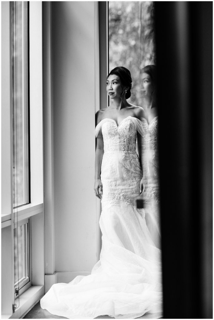 pnw novelty hill bride looking out window black and white