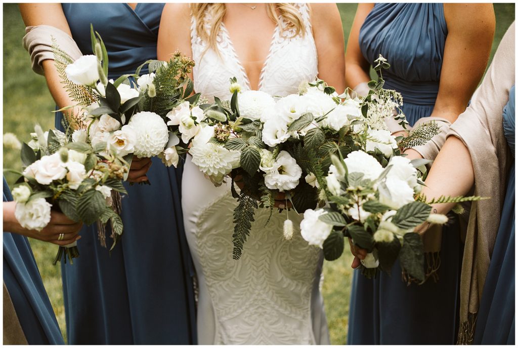 white floral bouquet bridesmaids blue dresses forest wedding
