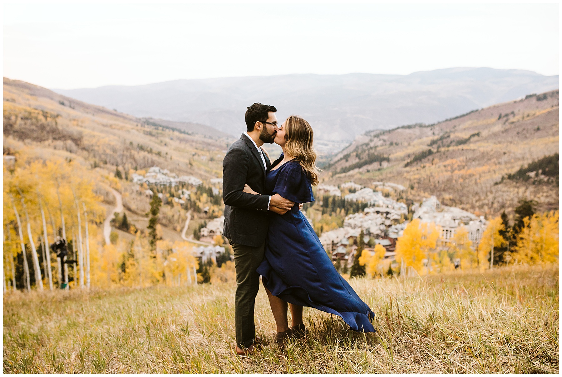 couple kissing at their fall engagement photos session in Colorado. 