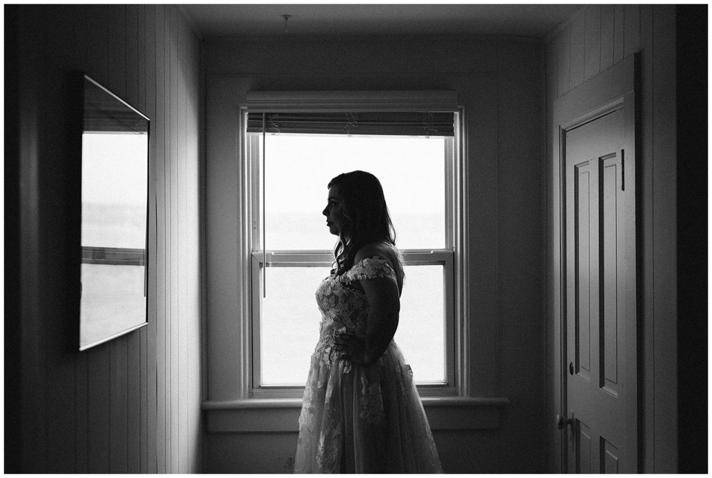 woman wearing wedding dress black and white picture vashon island elopement