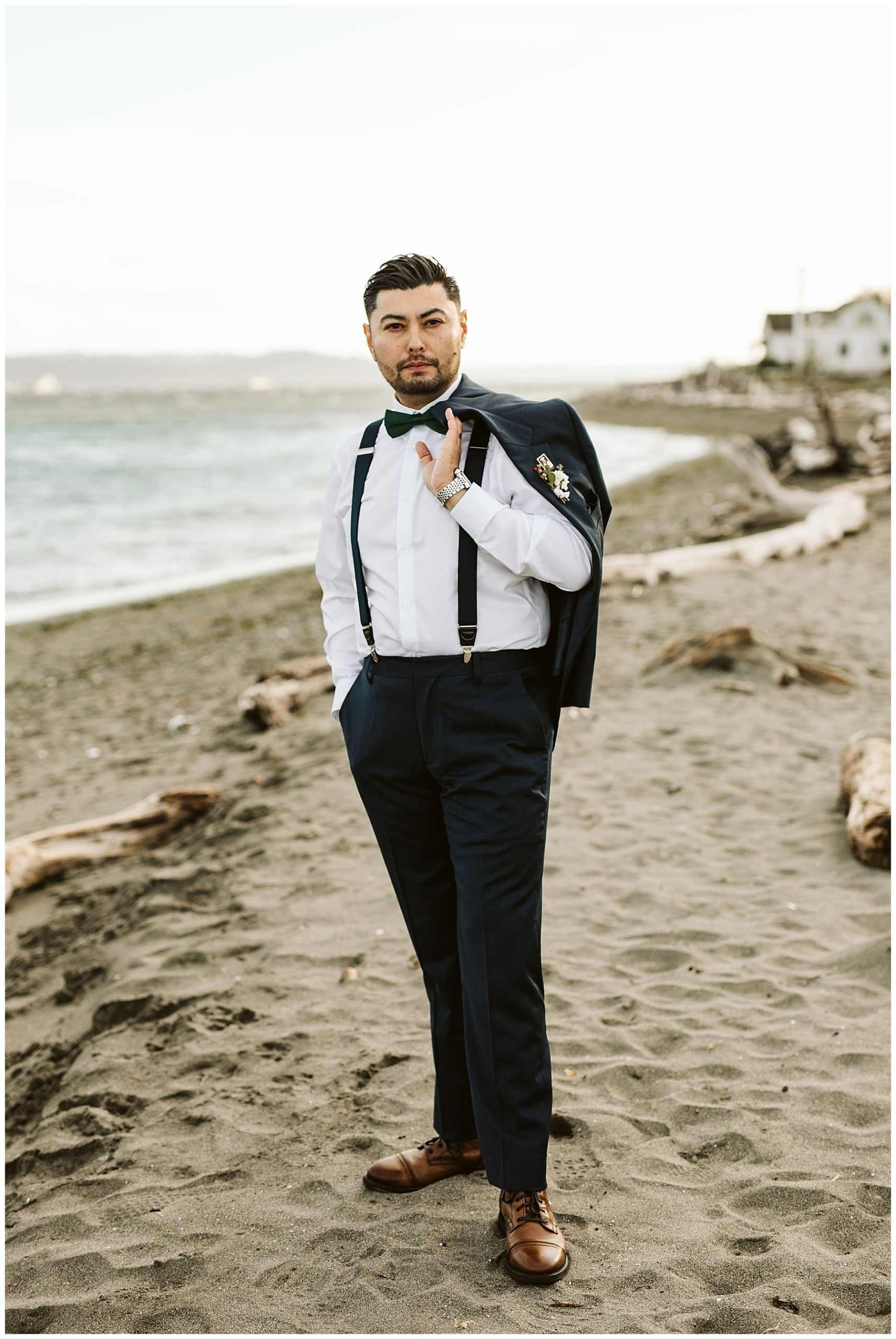 man in suit on beach on his wedding day