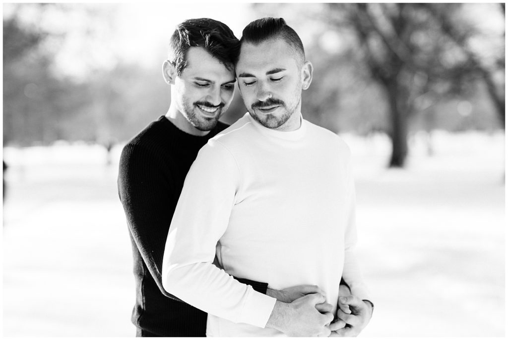 two men holding eachother in loving pose