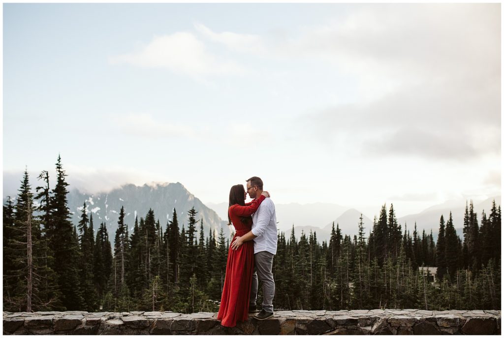 landscape photo of a couple kissing for their elopement on mount rainier shot by kelly lemon photography