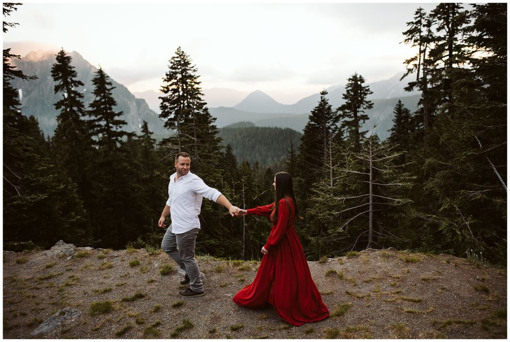 couple walking through forest near mount rainier for their elopement