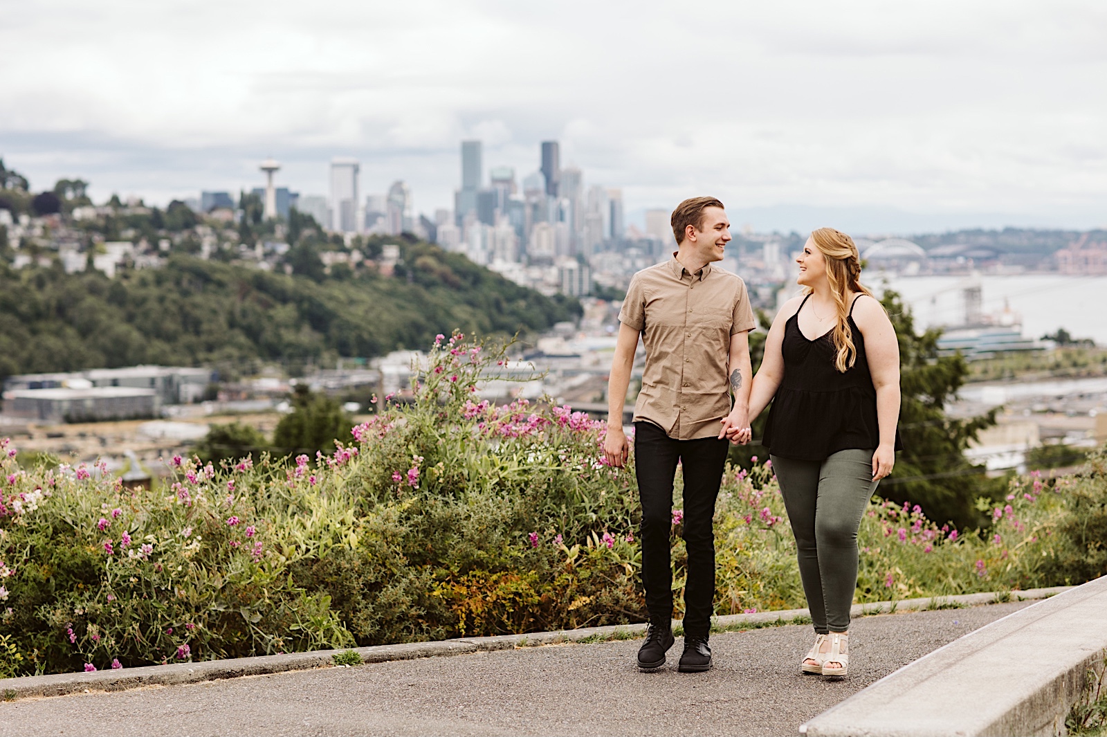 Scenic summer Seattle engagement photos with Seattle skyline in the background