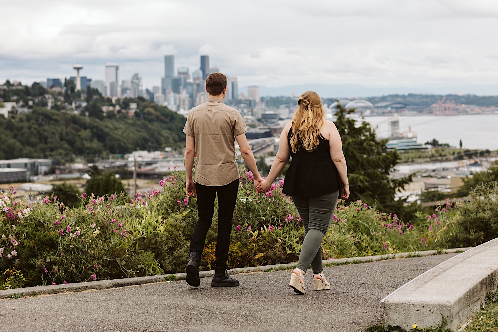 Scenic summer Seattle engagement photos with Seattle skyline in the background