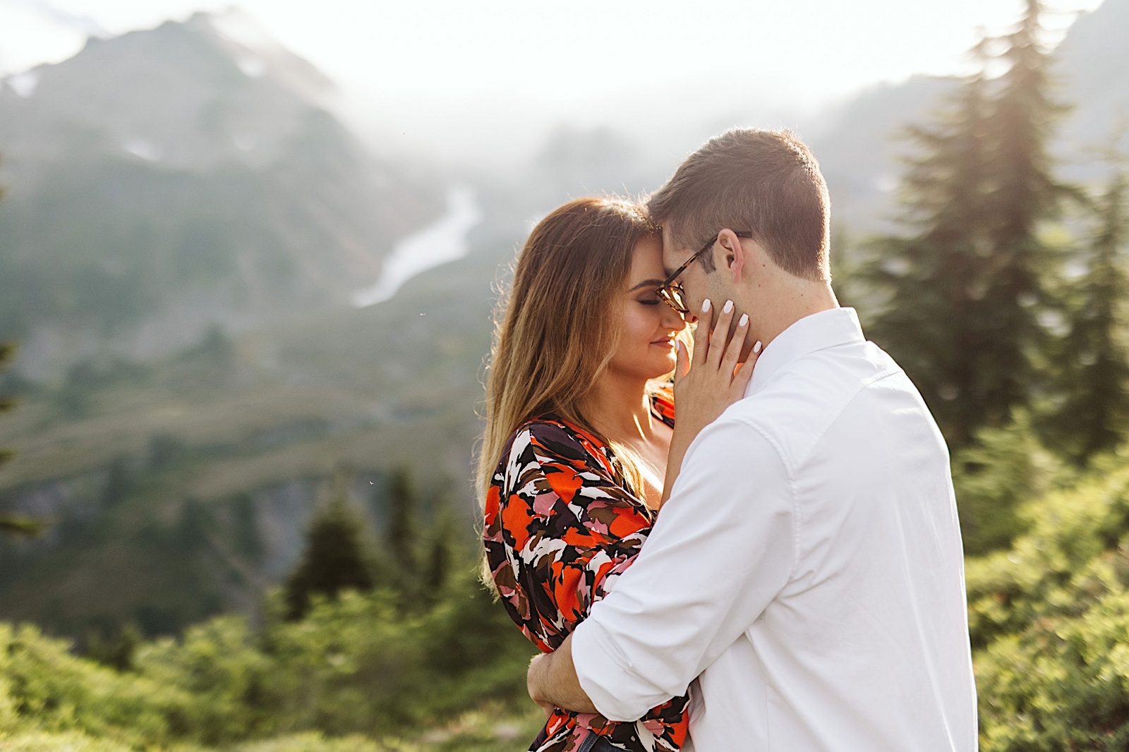 couple embraces at their engagement session at mt. baker