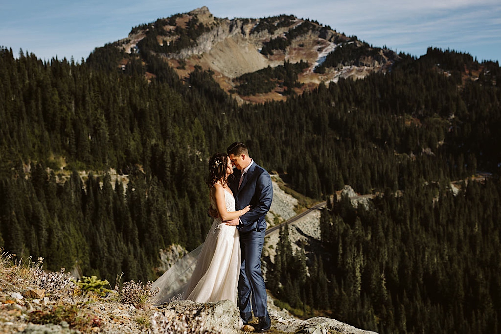 couple embraces on the mountainside at their mt. rainier elopement