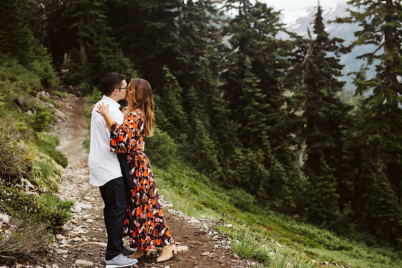 couple shares a kiss at their engagement session at mt. baker