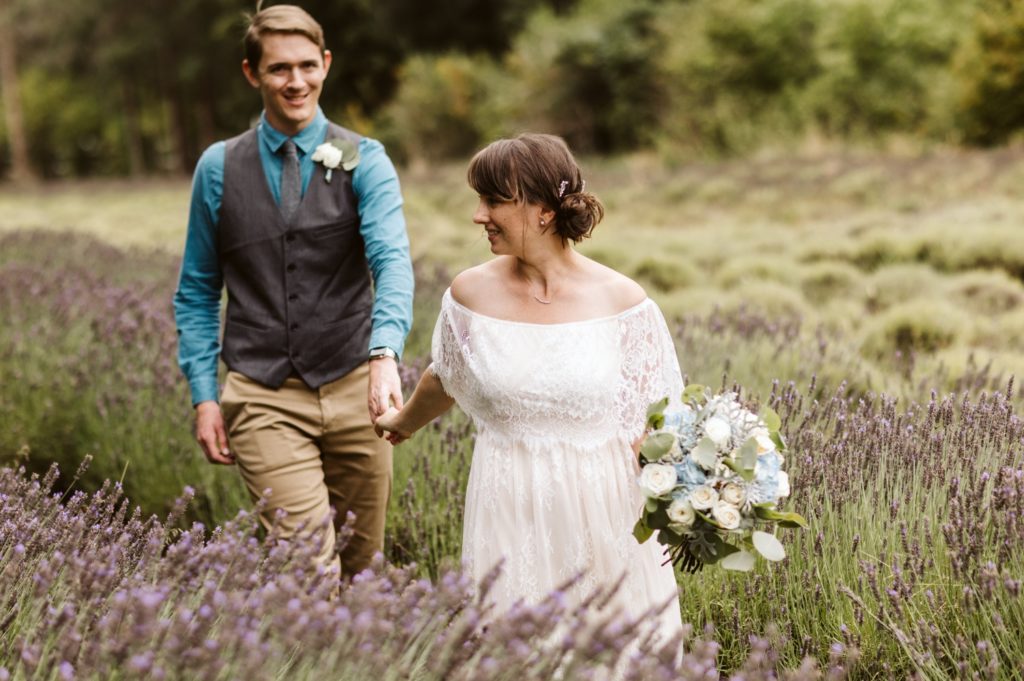 couple-walking-through-lavender-fields-at-Olympic-peninsula-elopement