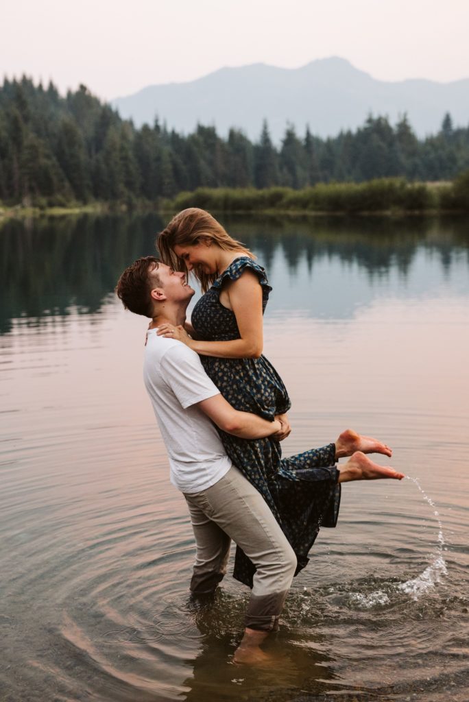 man-holding-woman-while-playing-in-lake