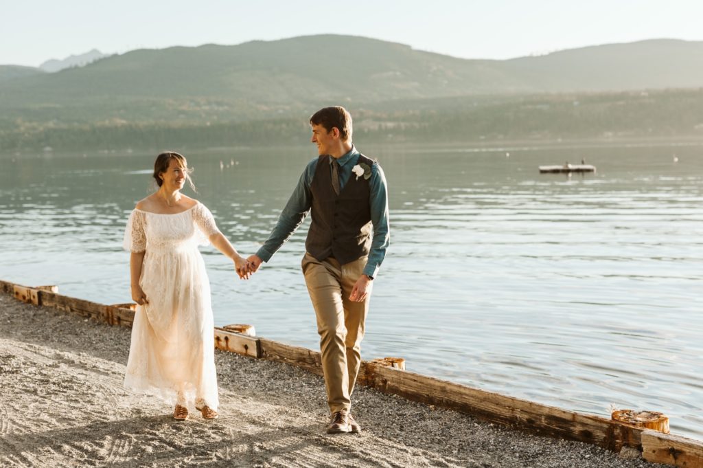 couple-holding-hands-at-lake-in-olympic-peninsula-elopement