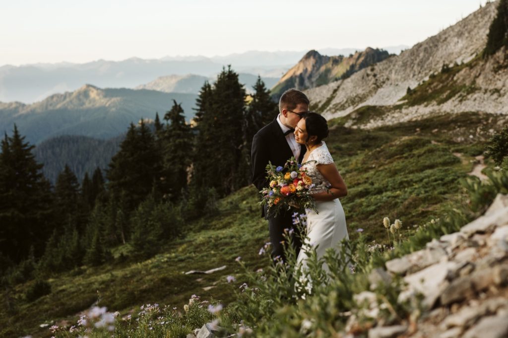 wedding-couple-hiking-in-valley-of-mount-rainier