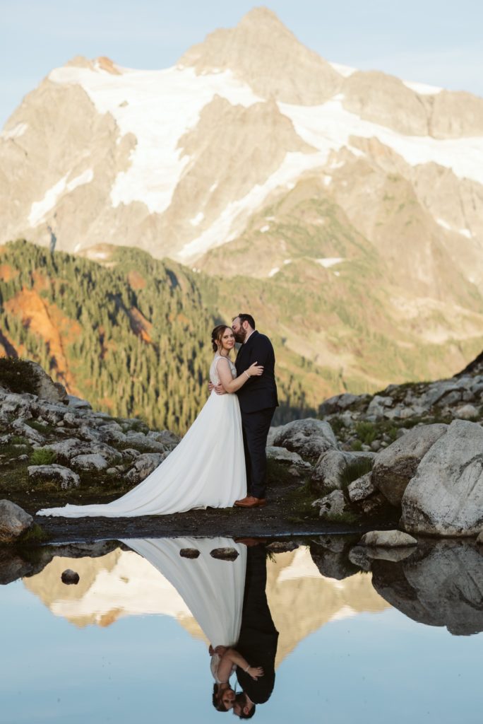 woman-in-wedding-dress-at-the-edge-of-a-lake-for-an-elopement-photoshoot