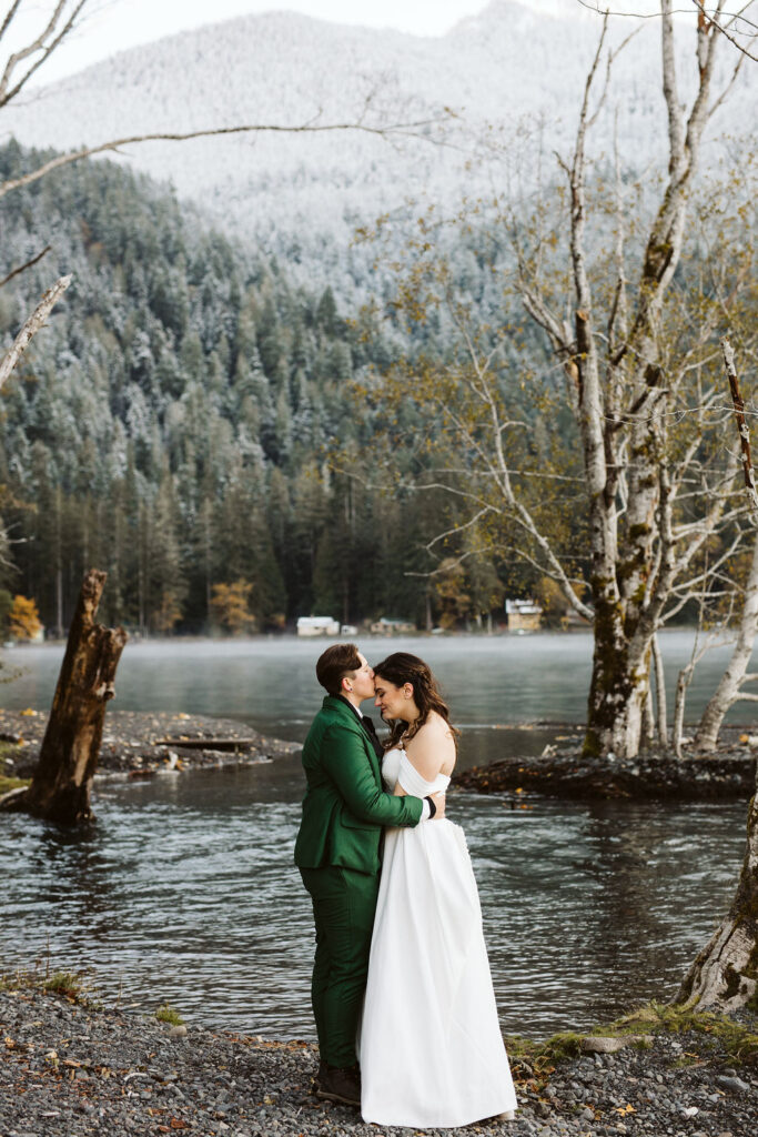 brides snuggle during lake crescent elopement