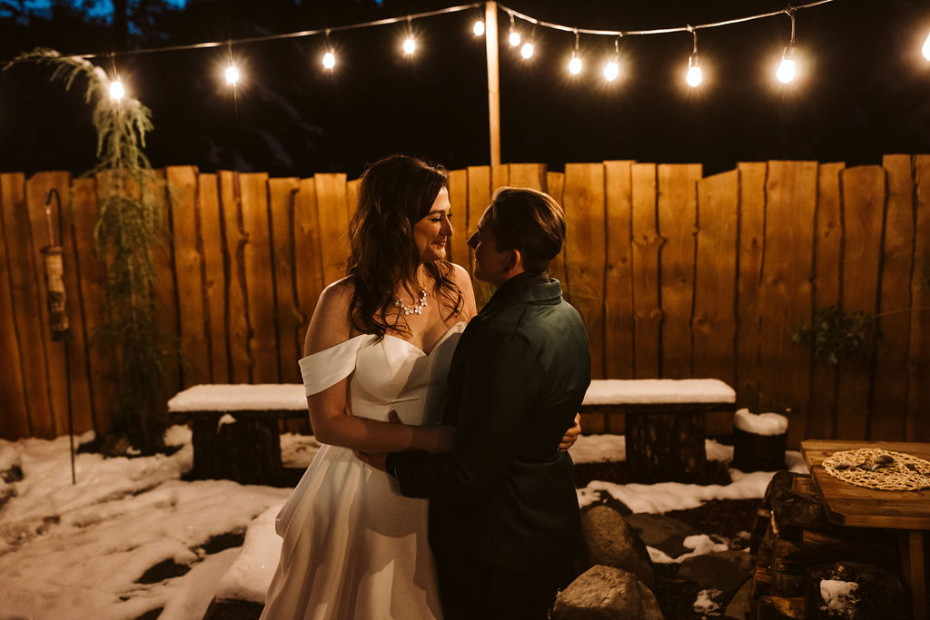 brides cuddle at airbnb intimate wedding