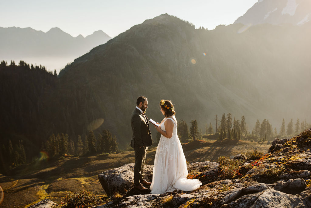 bride and groom read vows during north cascades elopement
