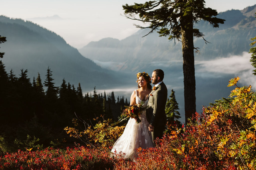 bride and groom are surrounded by fall foliage during mt baker elopement