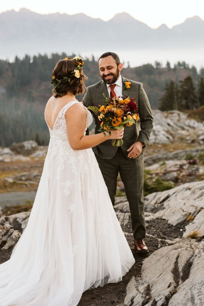 bride and groom have first look at each other on mount baker