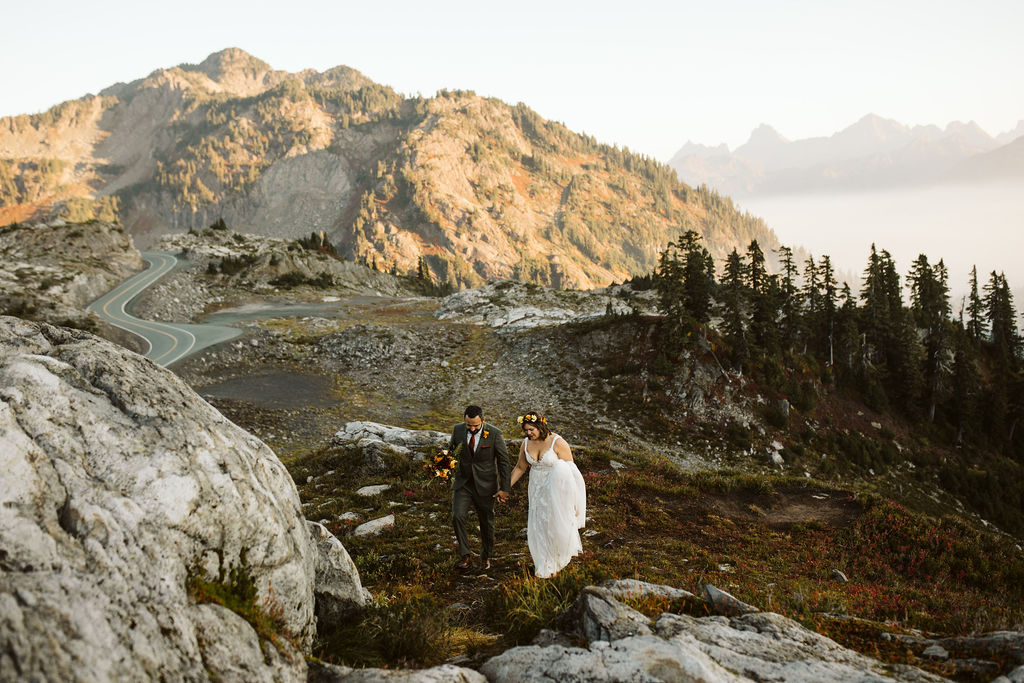 bride and groom walk among rocks during mt baker elopement