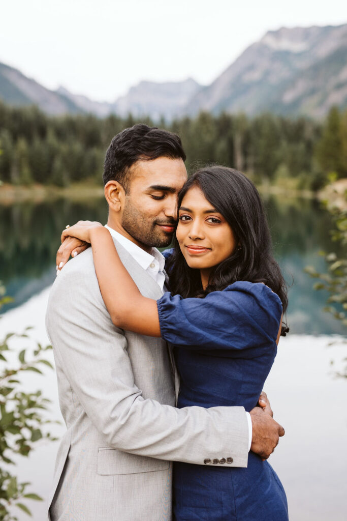 man and woman hold each other in front of Gold Creek Pond