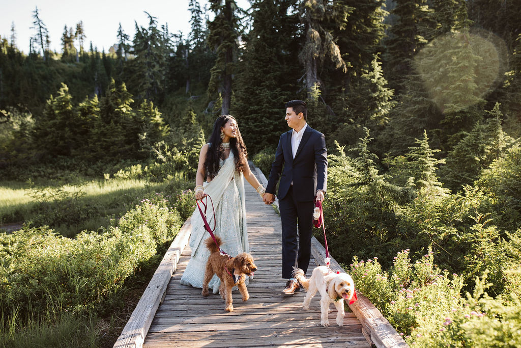boy and girl walk their dogs during mt baker engagement photos