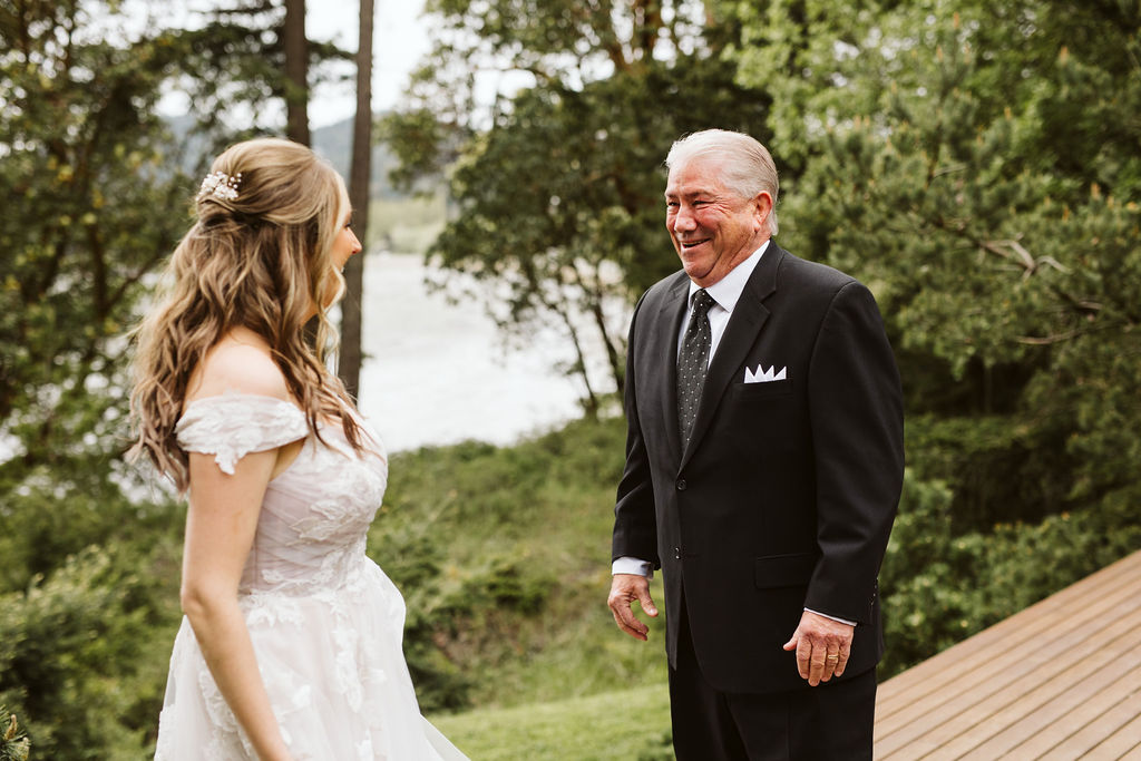 older man smiles and cries while seeing bride