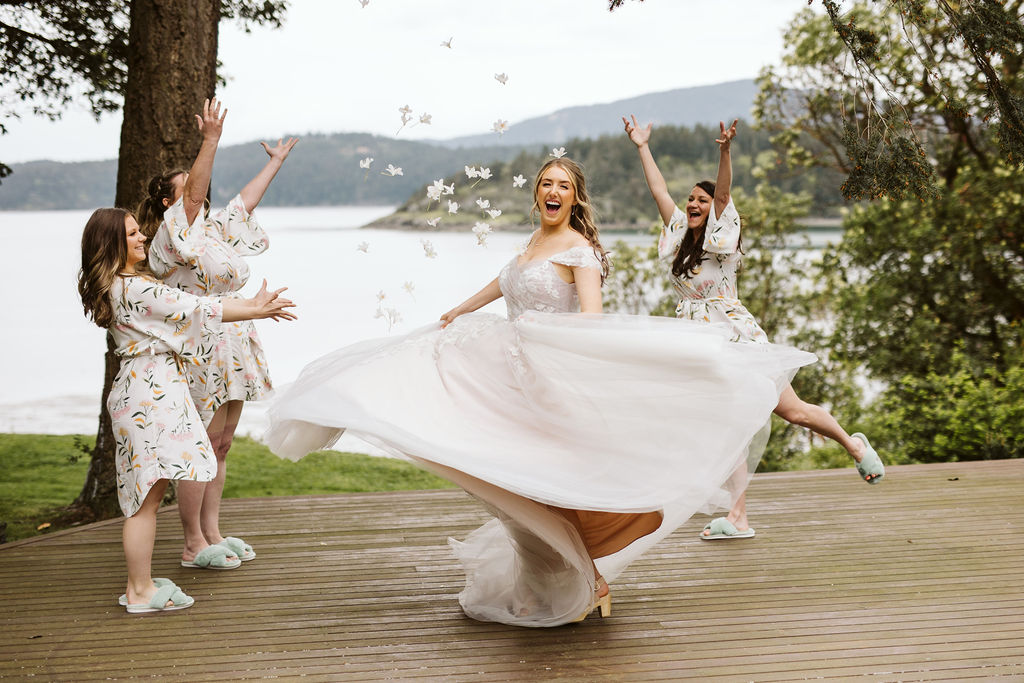 bride spins with the bridesmaids celebrating in the back ground