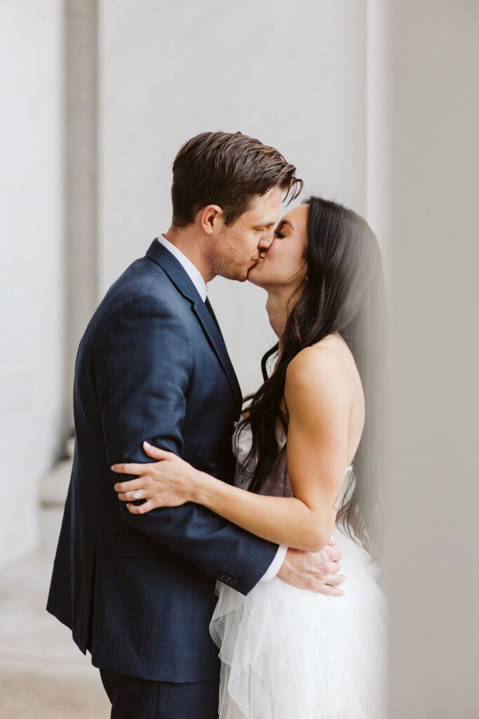 bride and groom kiss during denver elopement