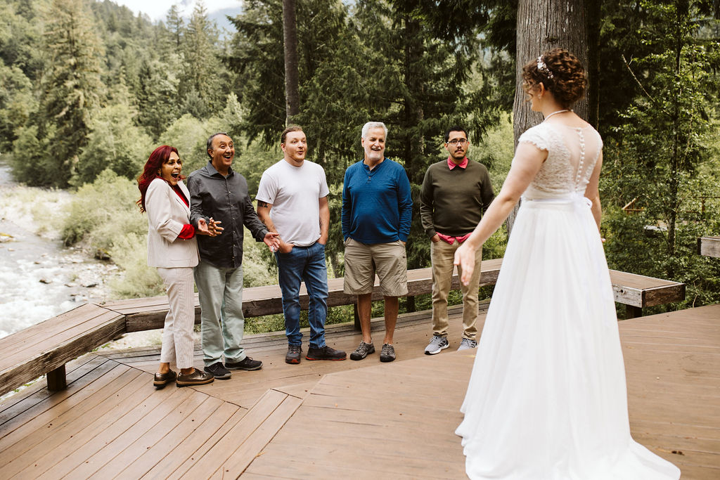 bride shows off dress to family