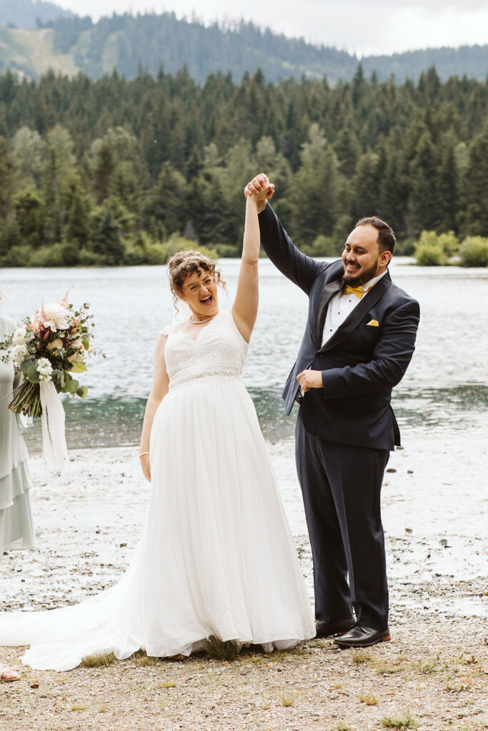 bride and groom cheer after snoqualmie elopement