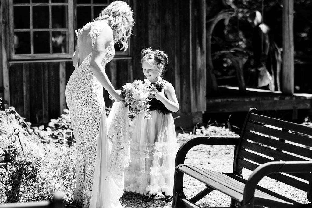 bride talks to a little girl