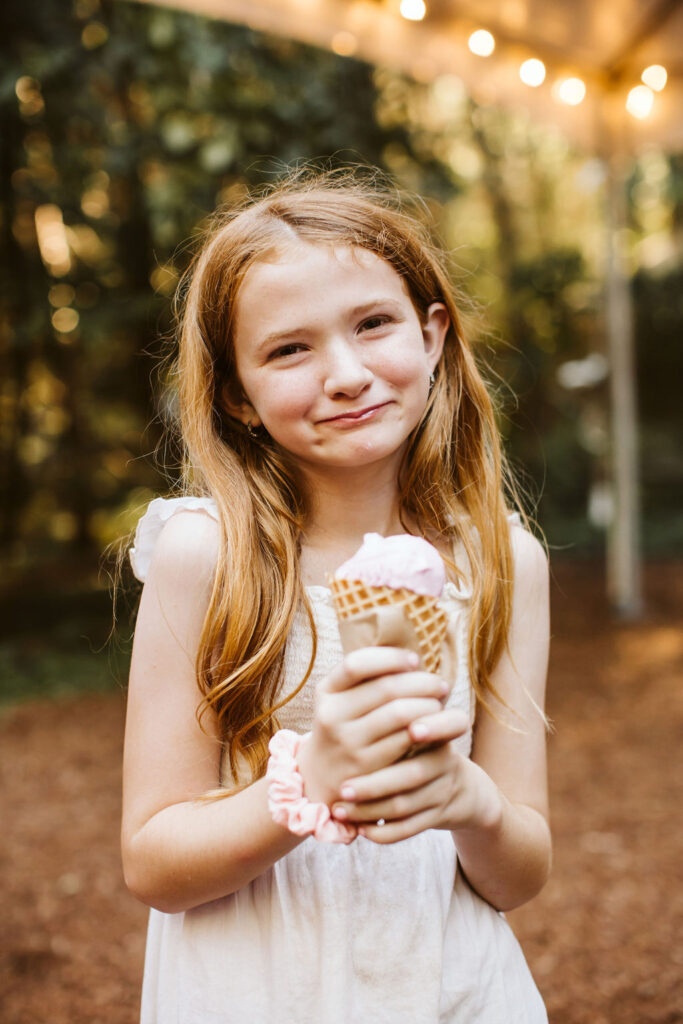 little girl holds ice cream