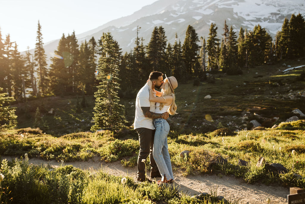boy and girl kiss at mt rainier engagement session