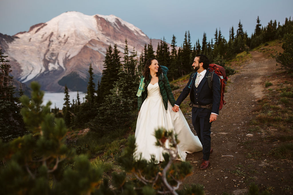 bride and groom hiked with mt rainier in the background